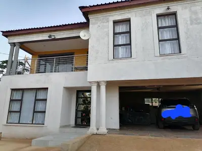 a car parked in the garage of a house at Sibusisiwe 2 in Tasakani