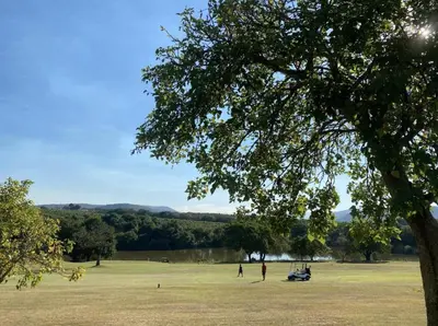 a group of people in a field with a tree at Kruger Park Lodge - Unit 522 , Hazyview in Hazyview