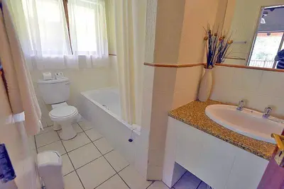 a bathroom with a toilet and a sink at Kruger Park Lodge - Unit 522 , Hazyview in Hazyview