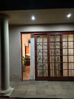 an open door to a house with a glass door at Cozy stay in Kempton Park