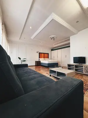 a living room with a couch and a bed at Cozy stay in Kempton Park