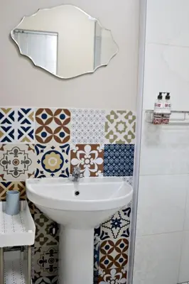 a bathroom with a sink and a mirror at Bokmakierie Gastehuis Emalahleni Pty Ltd in Witbank