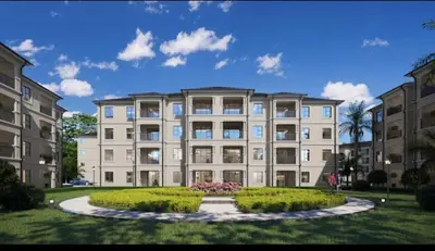 a large building with bushes in front of it at Lake view Apartment in Midrand