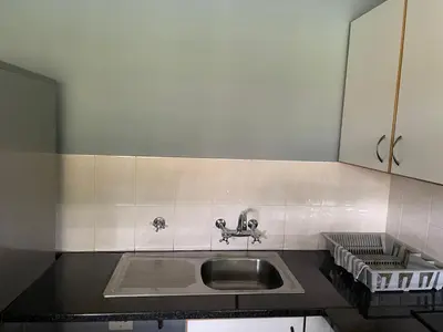 a kitchen with a sink and a counter at Pendleberry Grove Unit 8 in Bela-Bela