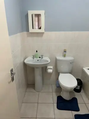 a bathroom with a toilet and a sink at Pendleberry Grove Unit 8 in Bela-Bela