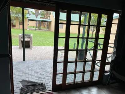 an open door with a view of a park at Pendleberry Grove Unit 8 in Bela-Bela