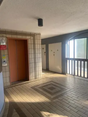 an empty room with doors and a tile floor at One Bedroom Apartment at Menlyn Place in Pretoria