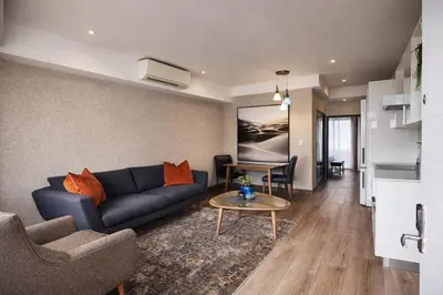 a living room with a couch and a table at 522 The Regency Menlyn in Pretoria
