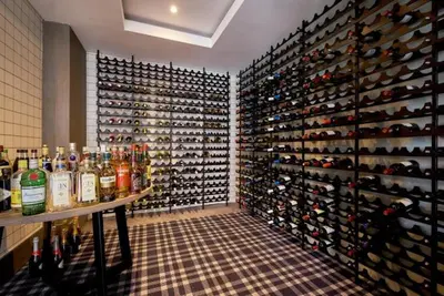 a wine cellar with a large wall of wine bottles at 522 The Regency Menlyn in Pretoria