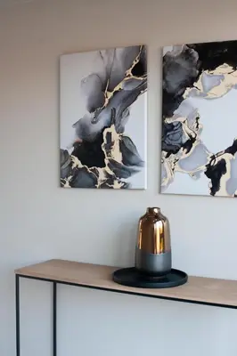 a shelf with three pictures on the wall with a tea kettle on it at Mi Casa Su Casa Dullstroom luxury family Villa 12 sleeper in Dullstroom