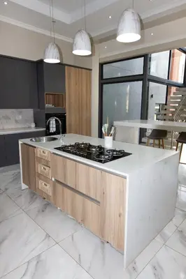 a kitchen with a island with a stove top at Mi Casa Su Casa Dullstroom luxury family Villa 12 sleeper in Dullstroom