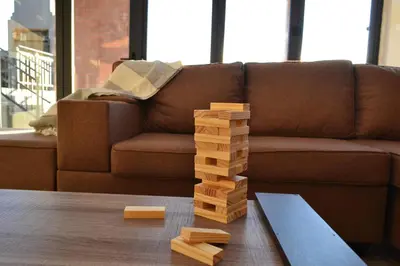 a stack of wooden blocks on a table in front of a couch at Mi Casa Su Casa Dullstroom luxury family Villa 12 sleeper in Dullstroom