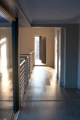 a hallway with stairs and a door in a building at Mi Casa Su Casa Dullstroom luxury family Villa 12 sleeper in Dullstroom