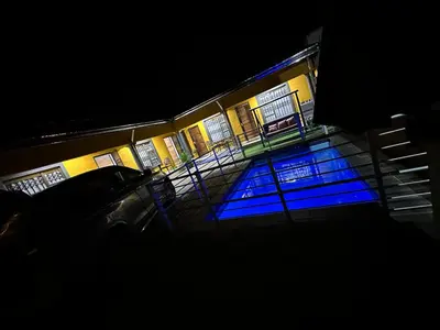 a building with blue lights on the side of it at StayComfyGuesthouseByPunky in Soshanguve