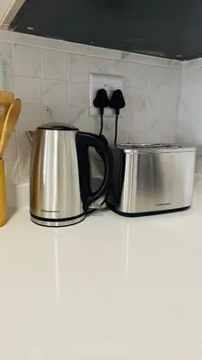 two coffee pots sitting on top of a kitchen counter at Luxury Apartment at 93 on New in Midrand
