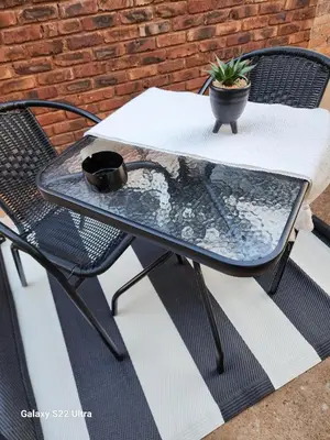 a patio table with a potted plant on it at Oblique Boutique House in Centurion