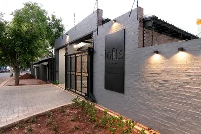 a building with a sign on the side of it at Menlyn Lofts in Pretoria