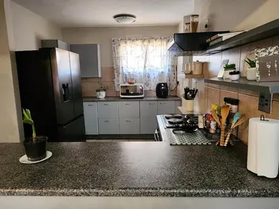 a kitchen with a counter top and a stove top oven at Pearl palace in Polokwane