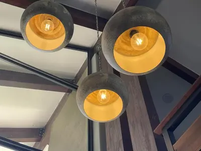 a group of lights hanging from a ceiling at Idyllic Kruger Breeze Marloth Park - 4 Bedroom in Marloth Park