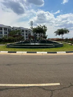 a large fountain in the middle of a street at The Blyde Crystal Lagoon - 3 Bedrooms with Lagoon Views in Pretoria