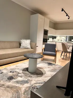 a living room with a couch and a table at 2115 Kepler, Ellipse - Serene Luxury in Midrand