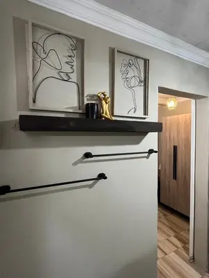 a room with a door with a shelf on the wall at Galpinii House in Pretoria