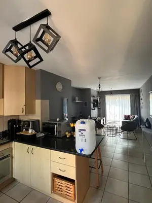 a kitchen with a counter and a table in it at 2 Spacious bedroom apartment in Ellisras