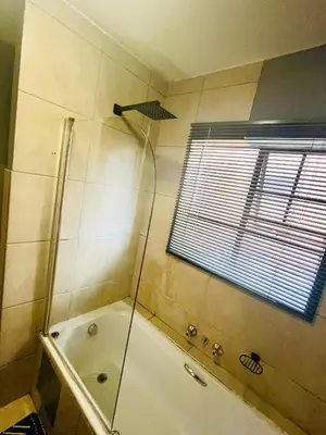 a bathroom with a shower and a bath tub at 2 Spacious bedroom apartment in Ellisras