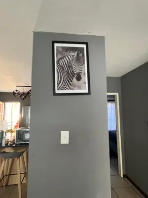 a black and white picture of a zebra on a wall at 2 Spacious bedroom apartment in Ellisras