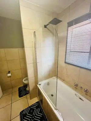 a bathroom with a shower and a bath tub at 2 Spacious bedroom apartment in Ellisras