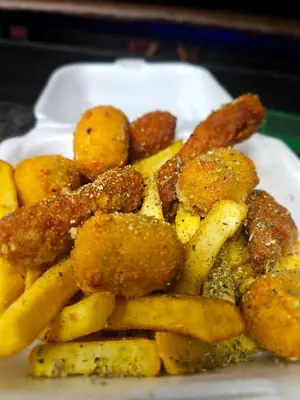a plate of food with meat and french fries at Malala Lodge in Lorraine
