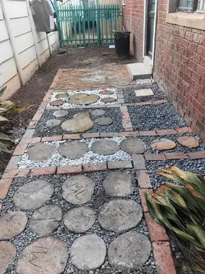 a stone walkway in front of a house at Tabularasa Hideaway in Pretoria