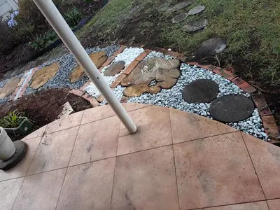a garden with a cat statue on a sidewalk at Tabularasa Hideaway in Pretoria