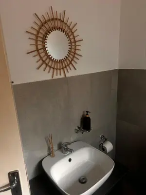 a bathroom with a sink and a mirror on the ceiling at 49 Bela-Bela Pendleberry Grove Holiday Unit 49 in Warmbaths