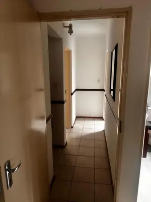a hallway of an apartment with a door open at 49 Bela-Bela Pendleberry Grove Holiday Unit 49 in Warmbaths