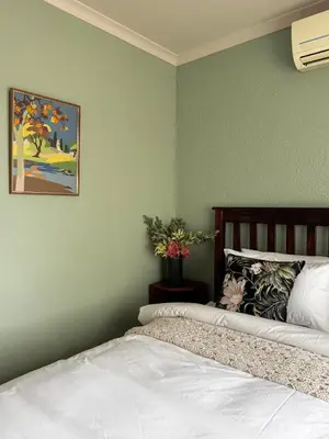 two beds sitting next to each other in a bedroom at Gallery Grove in Pretoria