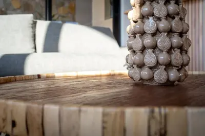 a group of ornaments on top of a wooden table at Khiwane Boutique Hotel in Hoedspruit