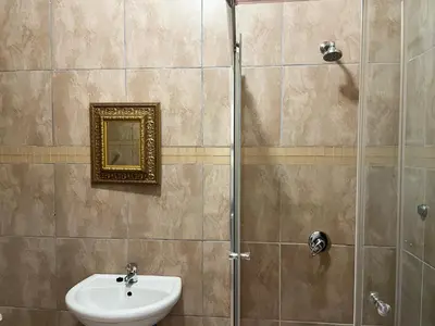 a bathroom with a sink and a shower at Bobisemo Luxury Guesthouse in Tierpoort