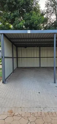 a large parking lot with a large metal building at Meander Sky in Centurion