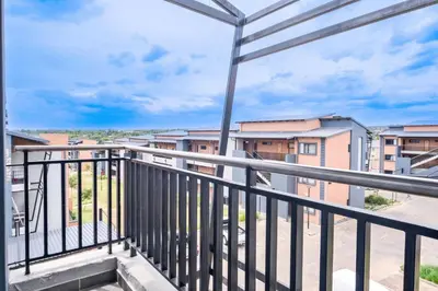 a balcony with a view of buildings at Diamond Hill in Midrand