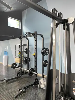 a gym with several treadmills and weights at Circa Aparthotel by unit 187 in Pretoria