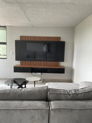 a living room with a couch and a flat screen tv at Circa Aparthotel by unit 187 in Pretoria