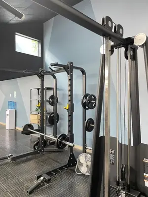 a gym with several treadmills and weights at Circa Aparthotel by unit 187 in Pretoria