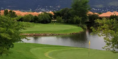 a view of a golf course with a river at Pecanwood Paradise in Hartbeespoort