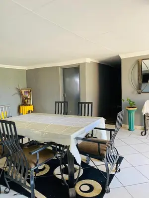 a dining room with a table and chairs at Graceland Recreation in Erasmus