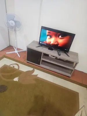 a flat screen tv sitting on top of a table at American horses in Pretoria