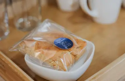 a package of food in a bowl on a table at Santai guesthouse in Brits