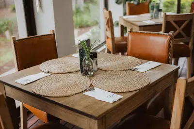 a wooden table with straw hats on top of it at Santai guesthouse in Brits