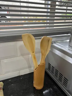 two wooden spoons sitting on a window sill at Soft Spaces Haven in Pretoria