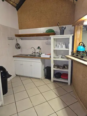 a kitchen with a sink and a counter top at The Big Rondawel in Marloth Park